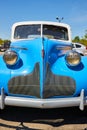 Vintage sky blue old Buick car, white cab with windows, large headlights Royalty Free Stock Photo