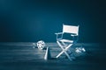 Image with vintage texture of a Director chair and movie items Royalty Free Stock Photo