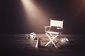 Image with vintage texture of a Director chair and movie items Royalty Free Stock Photo