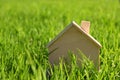 Image of vintage wooden toy house in the grass Royalty Free Stock Photo