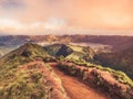 Image of walking path leading to a view on the lakes of Sete Cidades and Santiago during sunrise in Sao Miguel , Azores Royalty Free Stock Photo