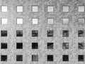 Image of a wall. Building with square windows. Pattern of squares.