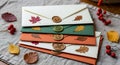 Autumn-Themed Decorative Envelopes with Wax Seals and Dried Leaves on Fabric Surface (AI-Generated) Royalty Free Stock Photo