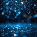 Image of water droplets falling to the ground in blue-toned bokeh. Royalty Free Stock Photo