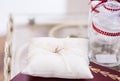 An image of wedding rings on the white pillow