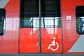 Image of wheelchair on the entrance door to the electric train car Royalty Free Stock Photo