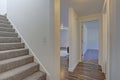 Image of a White hallway with a staircase