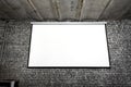 Image of white projector screen on gray brick wall Royalty Free Stock Photo