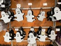 Halloween white happy ghosts for sale in a shop