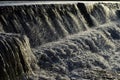 Flow of White Transparent Water with Sprinkling of Drops - A Checkdam - An artificial Waterfall