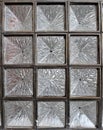 Image of a window made of colorless hammered glass blocks.