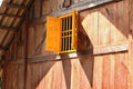 Yellow window on wooden house, Vietnam Royalty Free Stock Photo