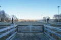 Winter arena for training horses in the forest at sunrise