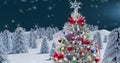 Image of winter scenery with christmas tree and snow falling on blue background Royalty Free Stock Photo