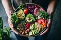 Image of a woman assembling a colorful Buddha bowl, with a variety of proteins ,vegetables and grains. Generative Ai