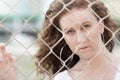 Image of a woman behind a fence Royalty Free Stock Photo