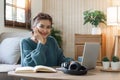 Image of woman cheery happy positive cute beautiful business woman sit indoors in home using laptop computer Royalty Free Stock Photo