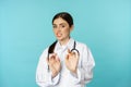 Image of woman doctor cringe, looking with dislike or aversion, rejecting, saying no, stay away, step back from Royalty Free Stock Photo