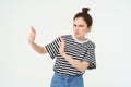 Image of woman expressing aversion, dislike something, looks apalled, extends hands forward in defensive gesture Royalty Free Stock Photo