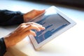 Image of woman hand pointing at touchscreen with business graph