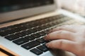 Image of woman hands using / typing on laptop computer selected focus on keyboard Royalty Free Stock Photo