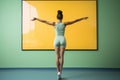 An image of a woman standing in front of a captivating and expansive painting., Woman following a dance fitness routine on