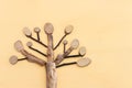 Image of wooden growing family tree on pastel background