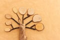 Image of wooden growing tree on brown recycled paper background Royalty Free Stock Photo