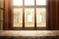 Image of wooden table in front of abstract blurred window light background Royalty Free Stock Photo