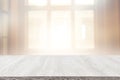 Image of wooden table in front of abstract blurred window light background Royalty Free Stock Photo