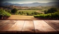 Image of wooden table in front of blurred vineyard landscape at sunset light. vintage filtered. glitter overlay Royalty Free Stock Photo