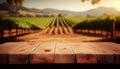 Image of wooden table in front of blurred vineyard landscape at sunset light. vintage filtered. glitter overlay Royalty Free Stock Photo