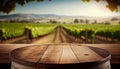 Image of wooden table in front of blurred vineyard landscape at sunset light. vintage filtered. glitter overlay Royalty Free Stock Photo