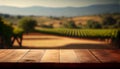 Image of wooden table in front of blurred vineyard landscape at sunset light. vintage filtered. glitter overlay Royalty Free Stock Photo