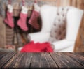 Image of wooden table in front of christmas blurred background o