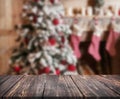 Image of wooden table in front of christmas blurred background o Royalty Free Stock Photo