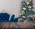 Image of wooden table in front of christmas blurred background o Royalty Free Stock Photo