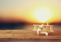 Image of wooden toy airplane over wooden table Royalty Free Stock Photo