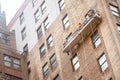 workers hanging on a house facade in New York