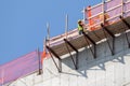 workers hanging on a house facade in New York