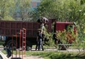 Workers load bags of rubbish onto a car ln Kandalaksha 3.06.2021