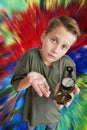 Boy hold a compass on colourful background