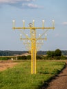 Image of yellow airport signal lights for airplanes