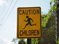 Image of a yellow traffic sign warning for nearby children. Royalty Free Stock Photo