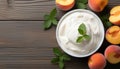 image of a yogurt and fresh peaches on the wooden table