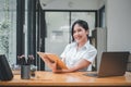 Image of young asian woman smiling and holding notebook, Royalty Free Stock Photo