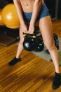 Image of young attractive female doing kettle bell exercise on g Royalty Free Stock Photo