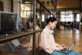 Image of young beautiful asian woman working on laptop in office Royalty Free Stock Photo