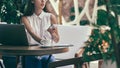 young business woman with a smartphone taking notes in her notebook. Royalty Free Stock Photo