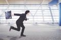 Young businessman running on the airport terminal Royalty Free Stock Photo